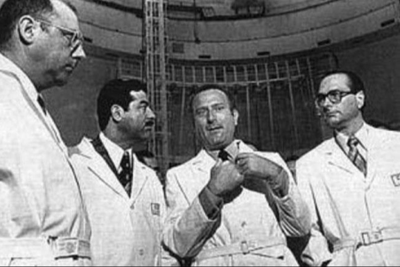Saddam Hussein and French Prime Minister Jacques Chirac (wearing glasses) visiting a French nuclear facility in 1975. (Photo via Portierramaryaire.com)