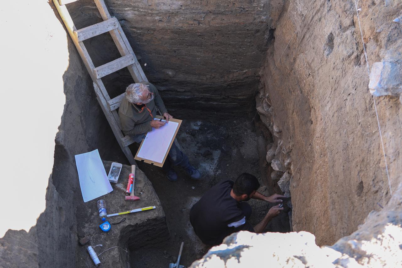 Researchers document stratigraphic layers inside an excavation trench at Iremir Hoyuk in Van’s Gurpinar district, eastern Türkiye, Nov. 10, 2025. (AA Photo)