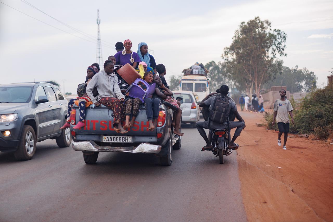 Passengers ride on the back of a crowded pickup truck in Bamako on Nov. 8, 2025. (AFP Photo)