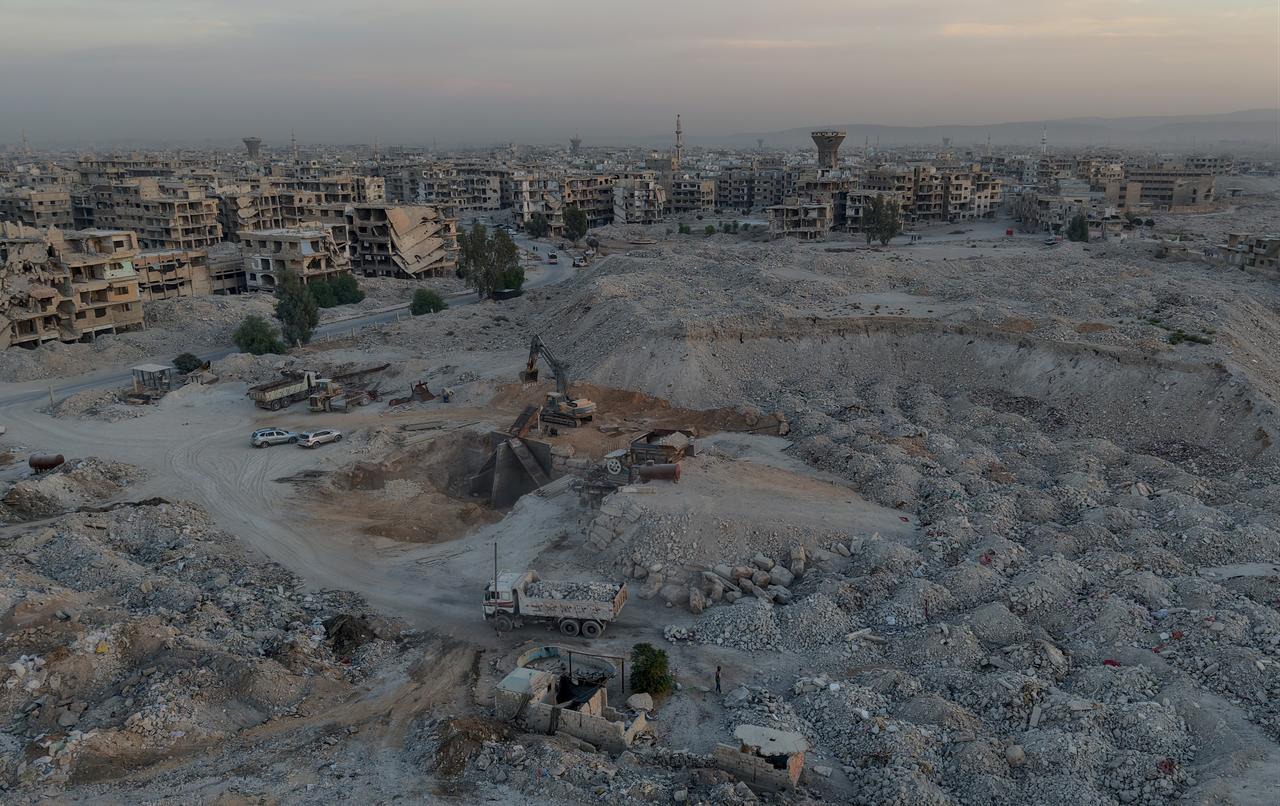 An aerial view of the damaged area as residents turn the concrete and stone debris from collapsed buildings into sand, gravel, and bricks to reuse as construction materials to restore what is left after years of civil war in Damascus, Syria, on November 2, 2025. (AA Photo)