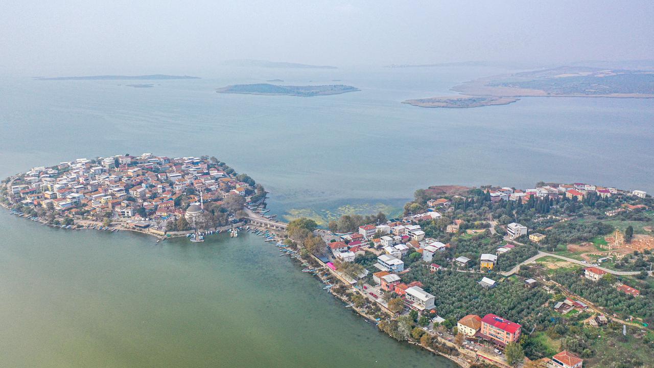 42 spectator seats discovered in scattered areas of the theater section of the ancient city of Apollonia ad Rhyndacum are relocated to their original places in Bursa, Türkiye, Nov. 6, 2025. (AA Photo)