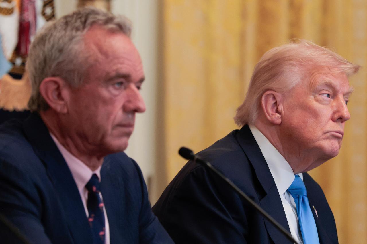 U.S. President Donald Trump and Human Services Secretary Robert F. Kennedy Jr. listen to speakers during an event on Health Technology in the East Room of the White House in Washington, U.S. on July 30, 2025. (AFP Photo)
