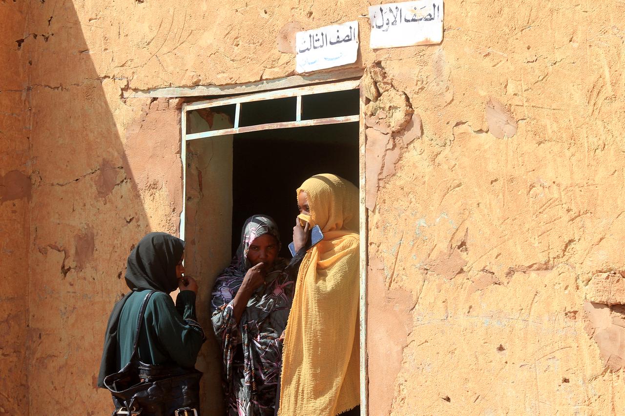 Three women, who are part of a group of displaced people from the towns of Bara and Umm Dam Haj Ahmed in North Kordofan State, take shelter in Omdurman, part of greater Khartoum, on November 10, 2025. ( AFP Photo )