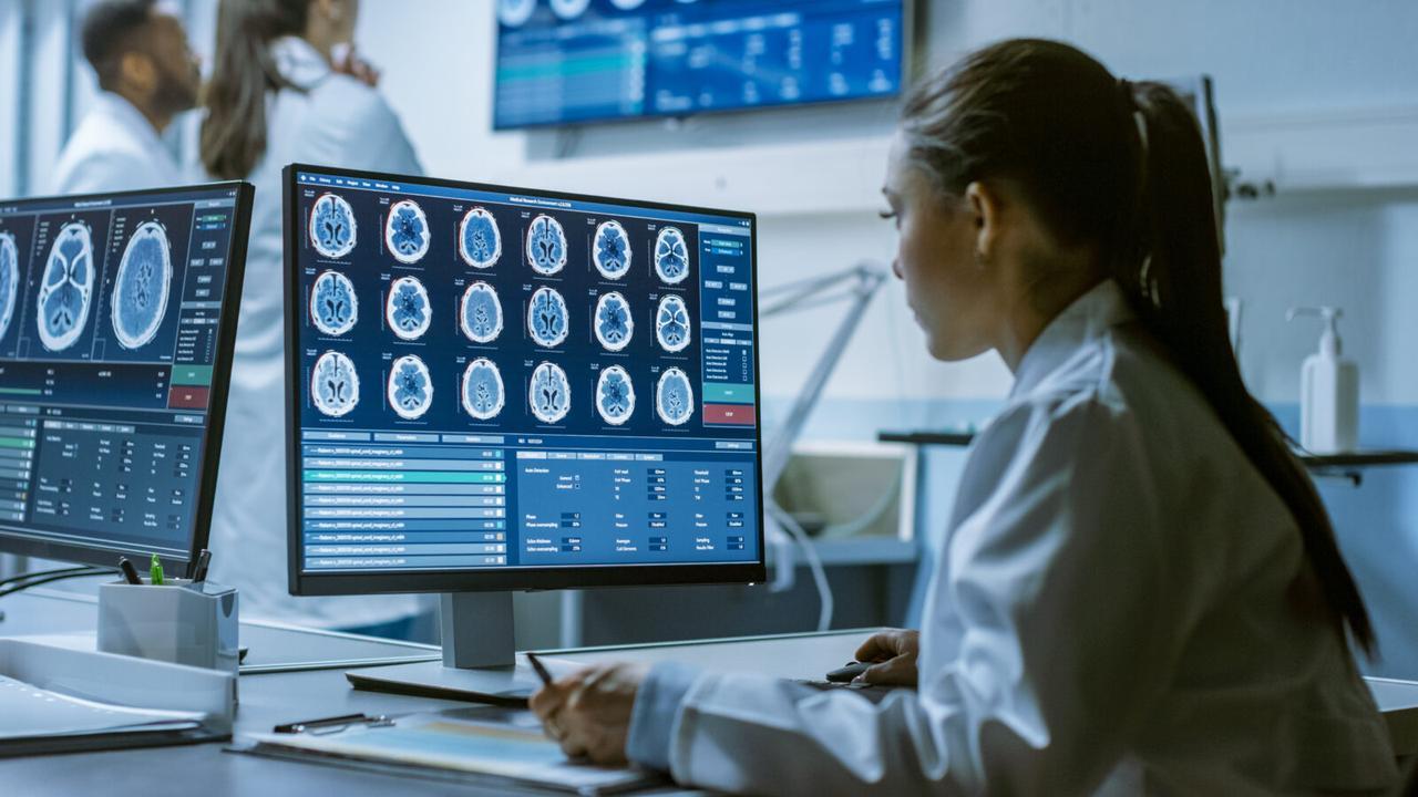 A healthcare personnel examining brain scans, accessed on Nov. 12, 2025. (Adobe Stock Photo)