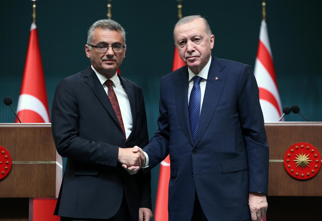 President Recep Tayyip Erdogan (R) and Turkish Republic of Northern Cyprus (TRNC) President Tufan Erhurman (L) shake hands as they pose for a photo before holding a joint press conference following their bilateral meeting at the Presidential Complex in Ankara, Türkiye on Nov. 13, 2025. ( TUR Presidency / AA Photo) )