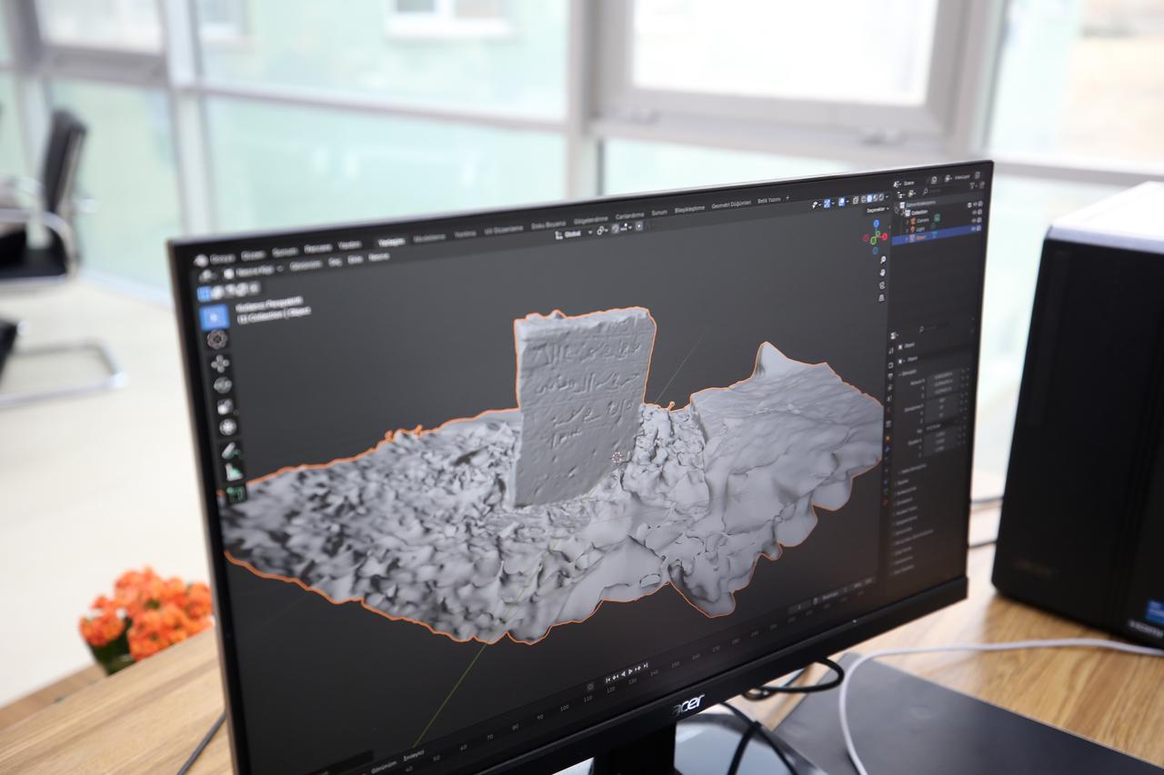 A 3D model of a Seljuk-era tombstone from the Malazgirt excavations appears on a computer screen at Mus Alparslan University, Mus, Türkiye, Nov. 13, 2025. (AA Photo)