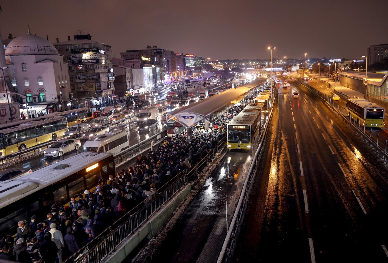 The crowd is seen at Sirinevler metrobus stop during a snowy winter day in Istanbul, Türkiye, Jan. 24, 2022. (AA Photo)