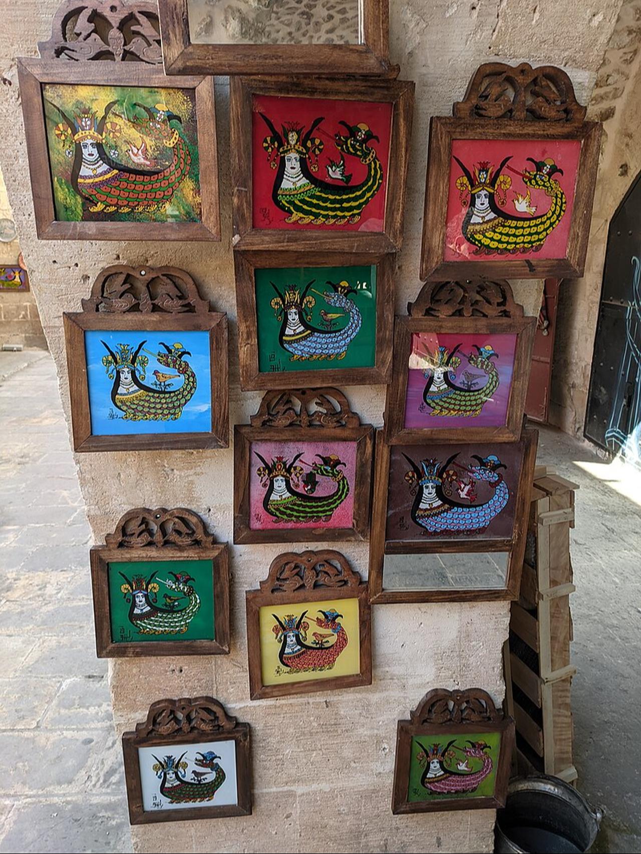 Paintings of Shahmaran, the legendary half-woman, half-snake figure of Anatolian mythology, on sale in Mardin, Türkiye. (Photo via Wikimedia)