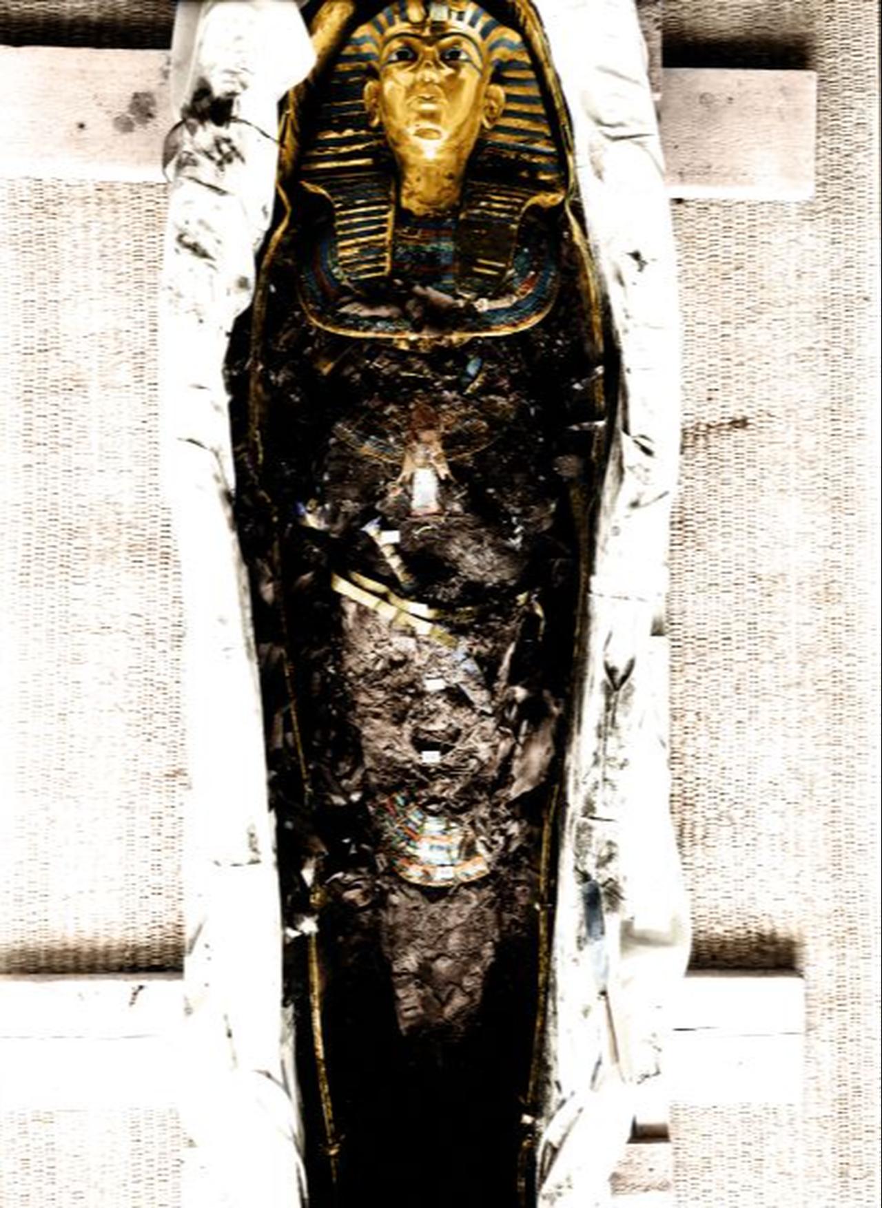 A colorised archival photograph shows Tutankhamun’s body during the 1925 autopsy, with his gold mask, falcon collar and ceremonial dagger still in place. (Photo by Harry Burton/Griffith Institute)
