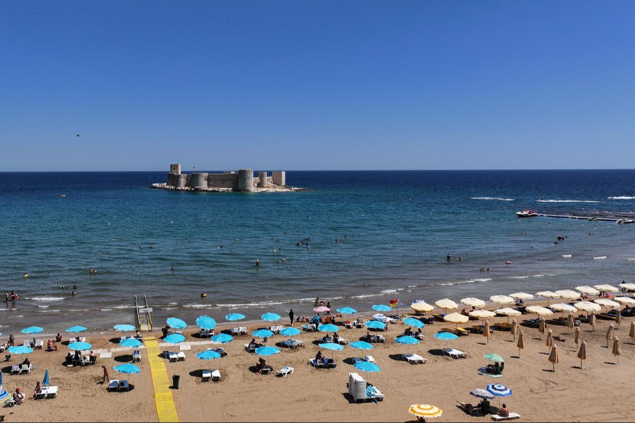 A view of the Blue Flag beach near Kizkalesi, part of the ancient city of Korykos on UNESCO’s World Heritage Tentative List, in Mersin, Türkiye, June 29, 2025. (AA Photo)