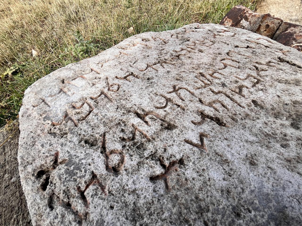 Details of the Aramaic characters preserved on the ancient stone, now under examination at the Kars Archaeology and Ethnography Museum in Kars, Türkiye, Nov. 17, 2025. (AA Photo)