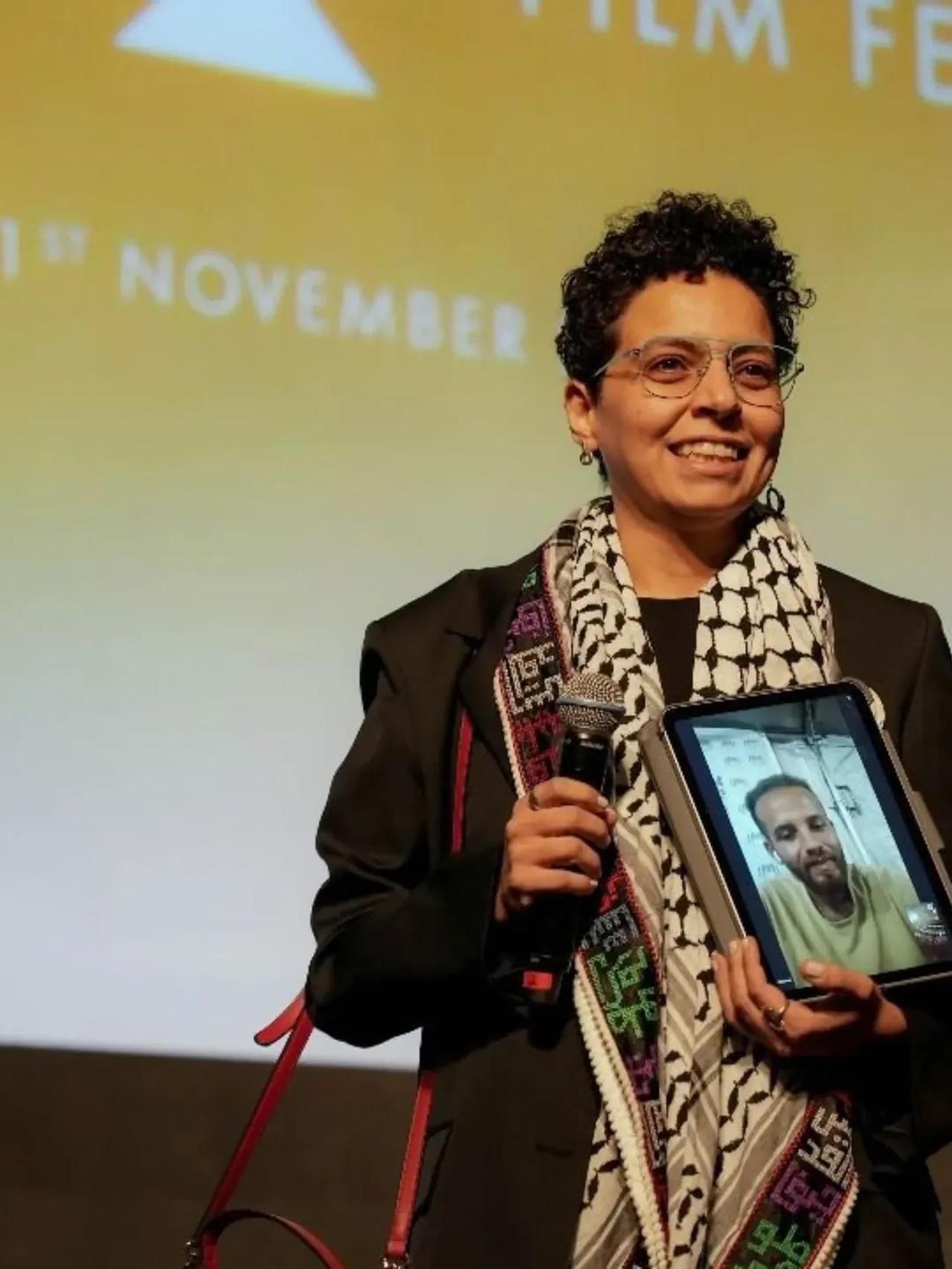 The young Egyptian director Mai Saad of the documentary One More Show, holding a video call with Palestinian director Ahmed Al-Danaf within the Gala section of the 46th Cairo International Film Festival, marking its world premiere on November 13, 2025. (Photo via Instagram \ @comagazine)