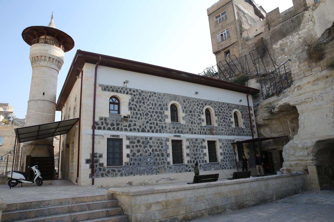 Exterior view of the historic rock carved Cave Mosque in Birecik, Sanliurfa, Türkiye, Nov. 17, 2025. (AA Photo)