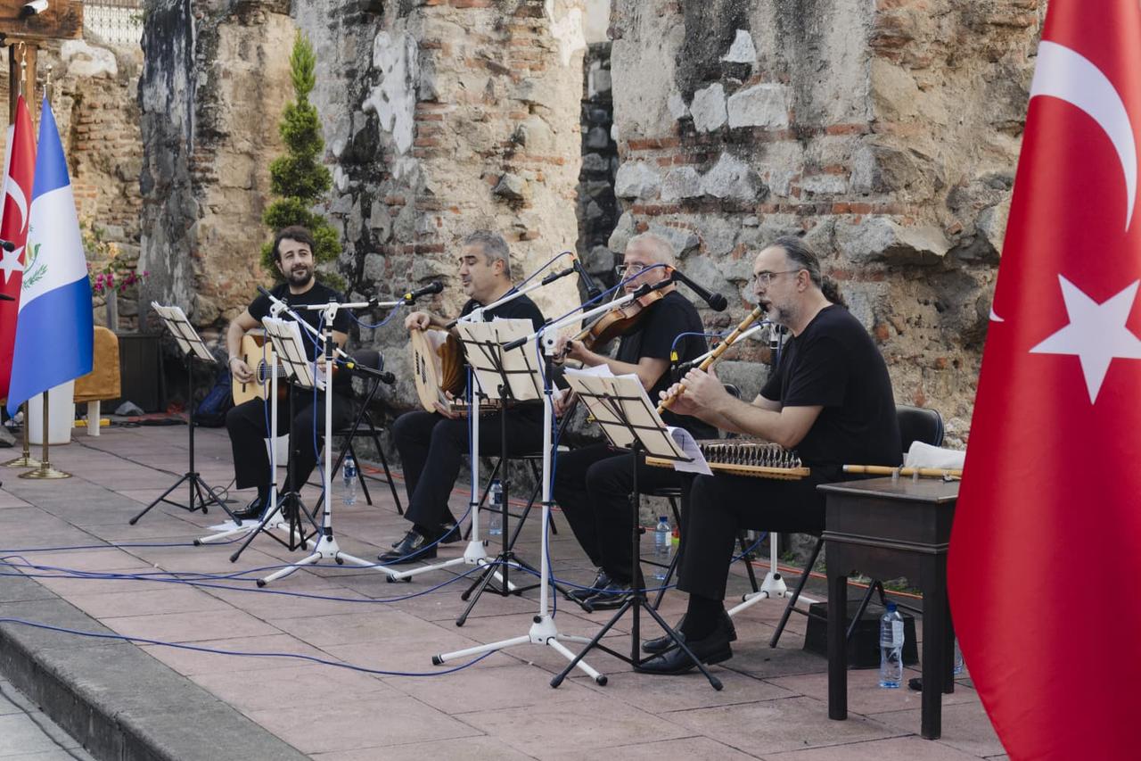 Members of the classical Turkish music ensemble Alla Turca Ornamenti perform in an open-air concert at the National Art Museum in Antigua, Guatemala, blending historic architecture with Turkish melodies, Nov. 17, 2025. (AA Photo)