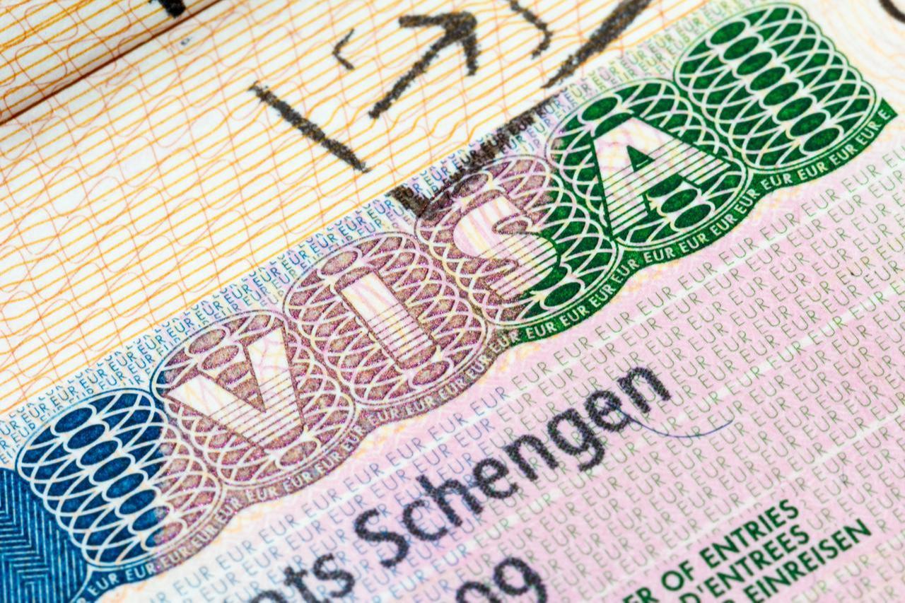 Schengen visa printed on a passport page, accessed on Nov. 18, 2025. (Adobe Stock Photo)