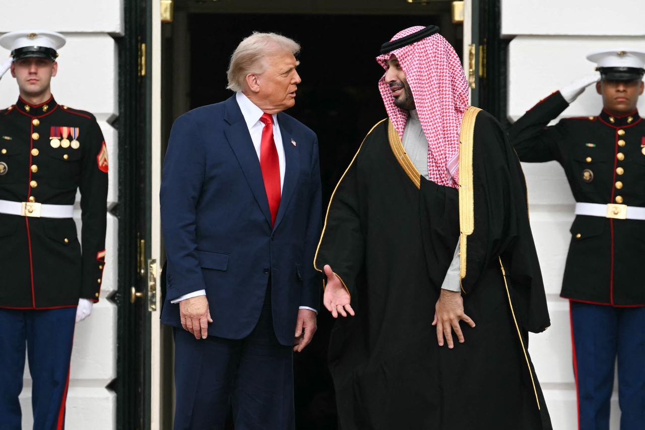 US President Donald Trump greets Crown Prince and Prime Minister of the Kingdom of Saudi Arabia Mohammed bin Salman on the South Lawn at the White House in Washington, DC on Nov. 18, 2025. (AFP Photo)