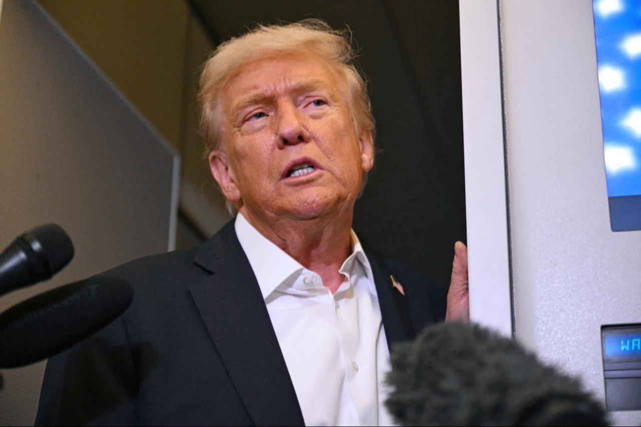 US President Donald Trump speaks with the press on board Air Force One in Mildenhall, Suffolk, on Oct. 14, 2025. (AFP Photo)