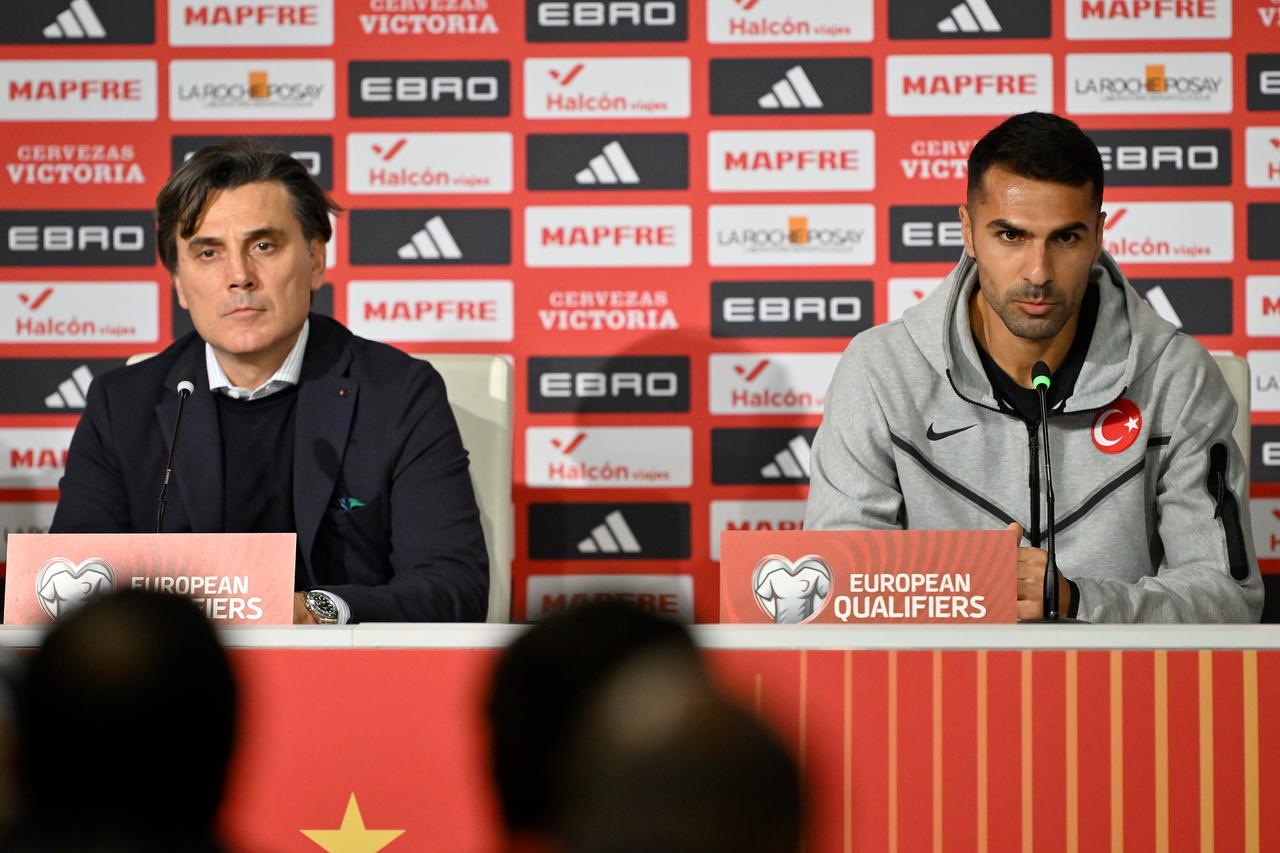 Türkiye national team coach Vincenzo Montella (L) and Turkish national football player Zeki Celik (R) attend a press conference held at La Cartuja Stadium ahead of the 2026 FIFA World Cup European Qualifiers Group E 6th match between Spain and Türkiye, in Sevilla, Spain, Nov. 17, 2025.  (AA Photo)