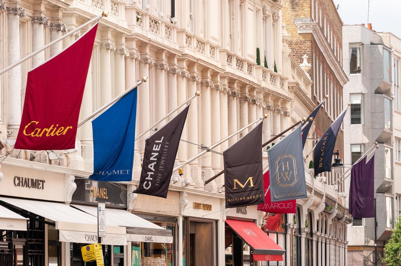 Luxury storefronts line New Bond Street in central London, United Kingdom, on June 7, 2008. (Adobe Stock Photo)