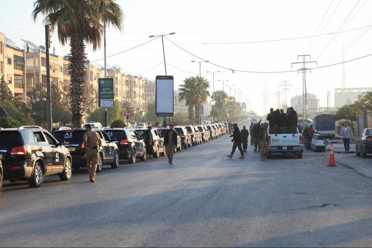 Security personnel in Aleppo from the Syrian Ministry of Interior react outside the Justice Palace ahead of the first trial of more than a dozen suspects linked to massacres. (AFP Photo)