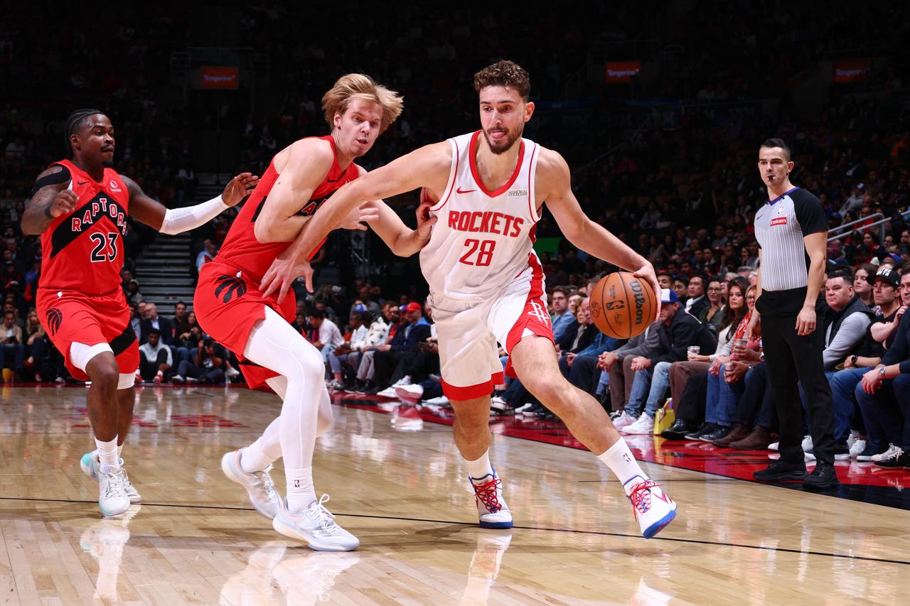 Alperen Sengun #28 of the Houston Rockets drives to the basket during the game against the Toronto Raptors on October 29, 2025, in Toronto, Ontario, Canada. (Photo by Vaughn Ridley/NBAE/Getty Images via AFP)