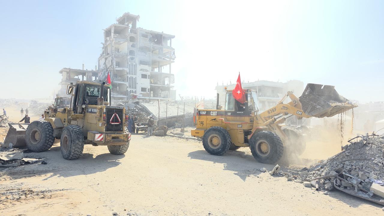 People conduct debris removal operations supported by Turkish associations in Khan Yunis, Gaza, on November 1, 2025. (AA Photo)
