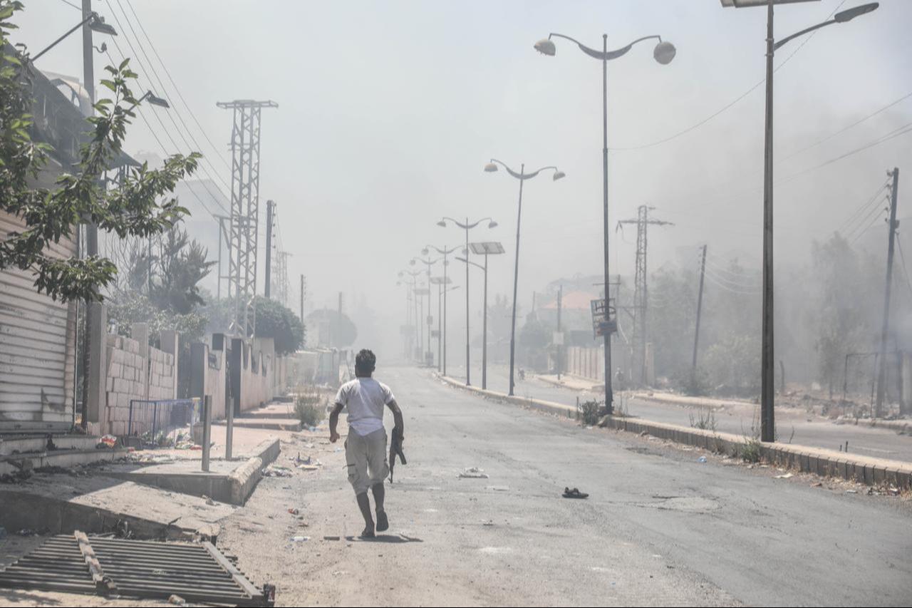Photo shows clashes between Bedouin Arabs and some Druze armed groups in Sweida Syria on July 19, 2025. (AA Photo)