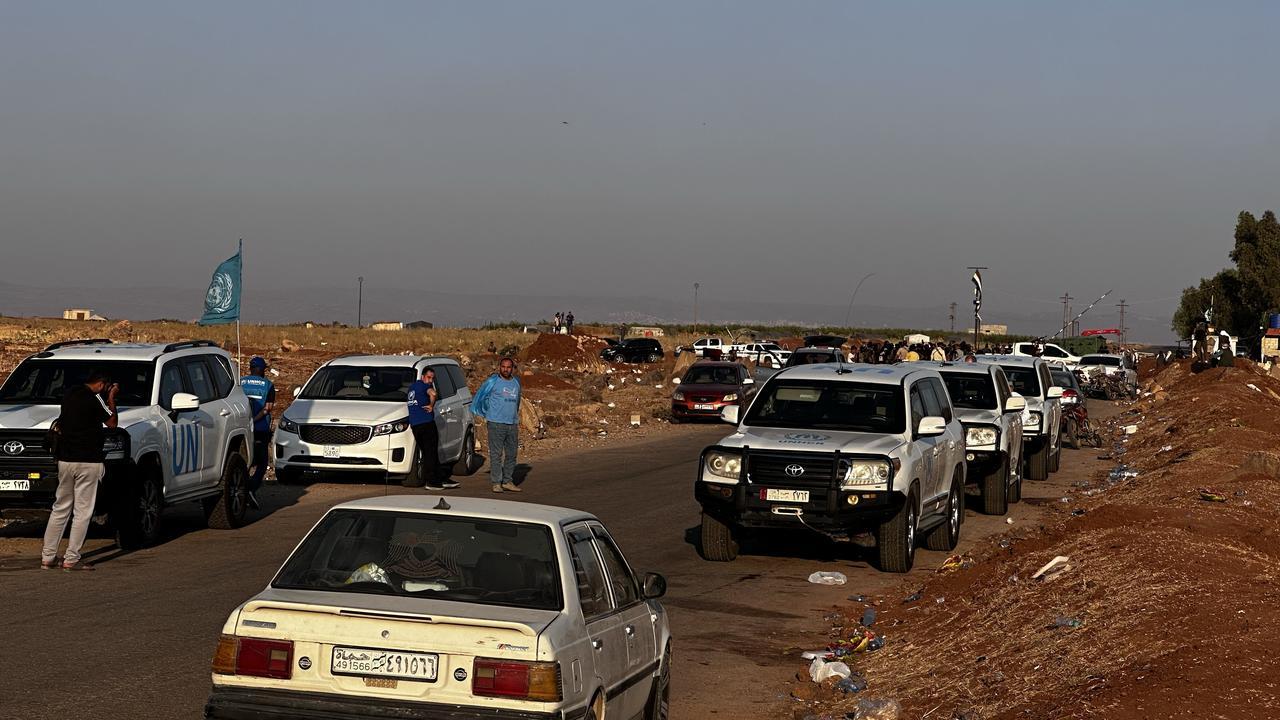 A convoy of 11 buses enters the city center of Sweida as part of a ceasefire and evacuation agreement between Syria’s Interior Ministry and Druze leader Hikmat al-Hijri in Sweidaa, Syria on July 22, 2025. (AA Photo)