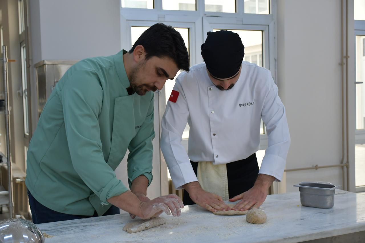 Academic staff knead barley-based dough to replicate a 3,000-year-old honey-barley bread described in cuneiform sources, Batman University, Batman, Türkiye, Nov. 20, 2025. (AA Photo)