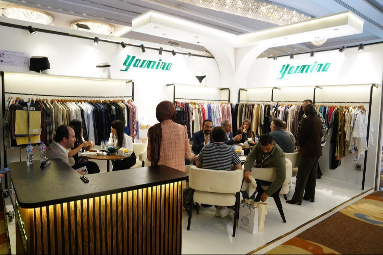 Participants in Destination Africa 2025 are seen chatting inside the Egyptian textile brand Yasmina's stand during the fair in Egypt's capital, Cairo, on November 12. 2025. (Photo credit: Destination Africa)