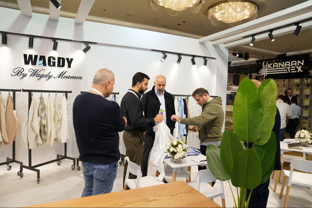 Participants in Destination Africa 2025 are seen chatting inside the Egyptian textile brand Wagdy's stand during the fair in Egypt's capital, Cairo, on November 12. 2025. (Photo credit: Destination Africa)