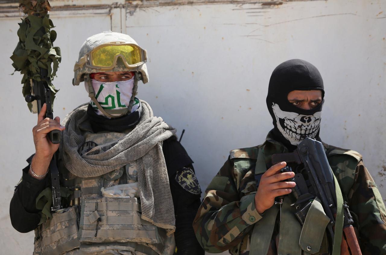 Members of an unidentified Shia militia near Amerli, Iraq in August 2014. (AFP Photos)