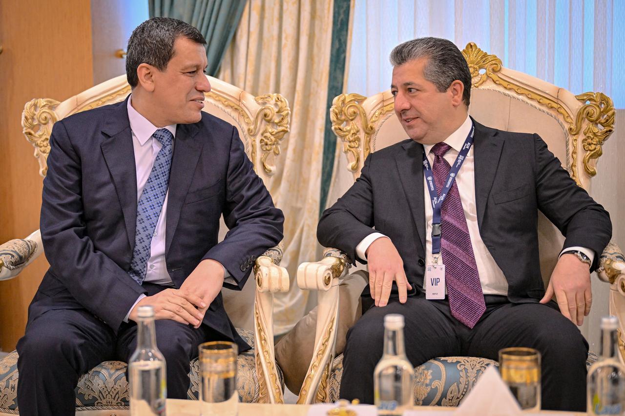 A handout picture released on November 19, 2025 by the Iraqi Kurdistan Regional Government shows Prime Minister Masrour Barzani (R) meeting with Mazloum Abdi. (AFP Photo)