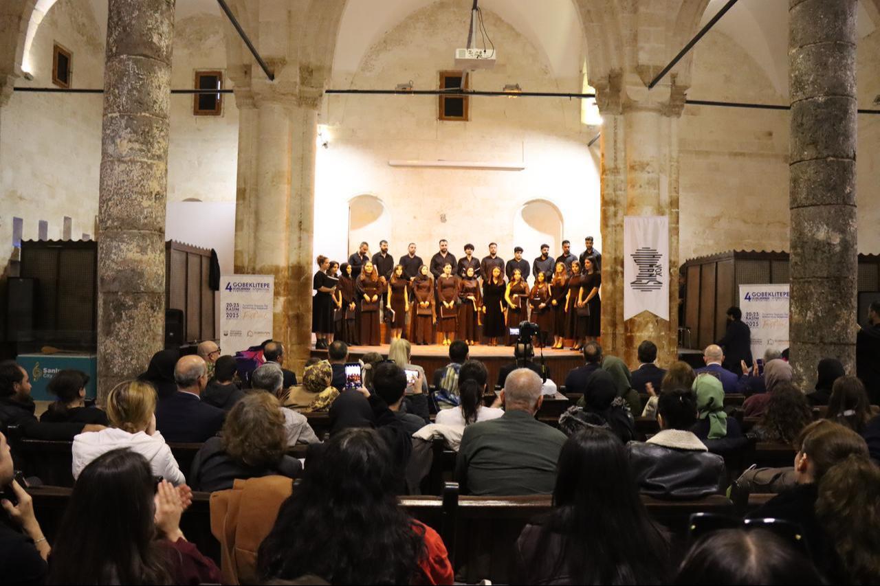 Members of the Harran University Education Faculty Vox Humanis Polyphonic Choir perform on stage during the opening ceremony of the 4th Gobeklitepe International Film Festival at the historic Reji Church in Sanliurfa, Türkiye, Nov. 20, 2025. (AA Photo)