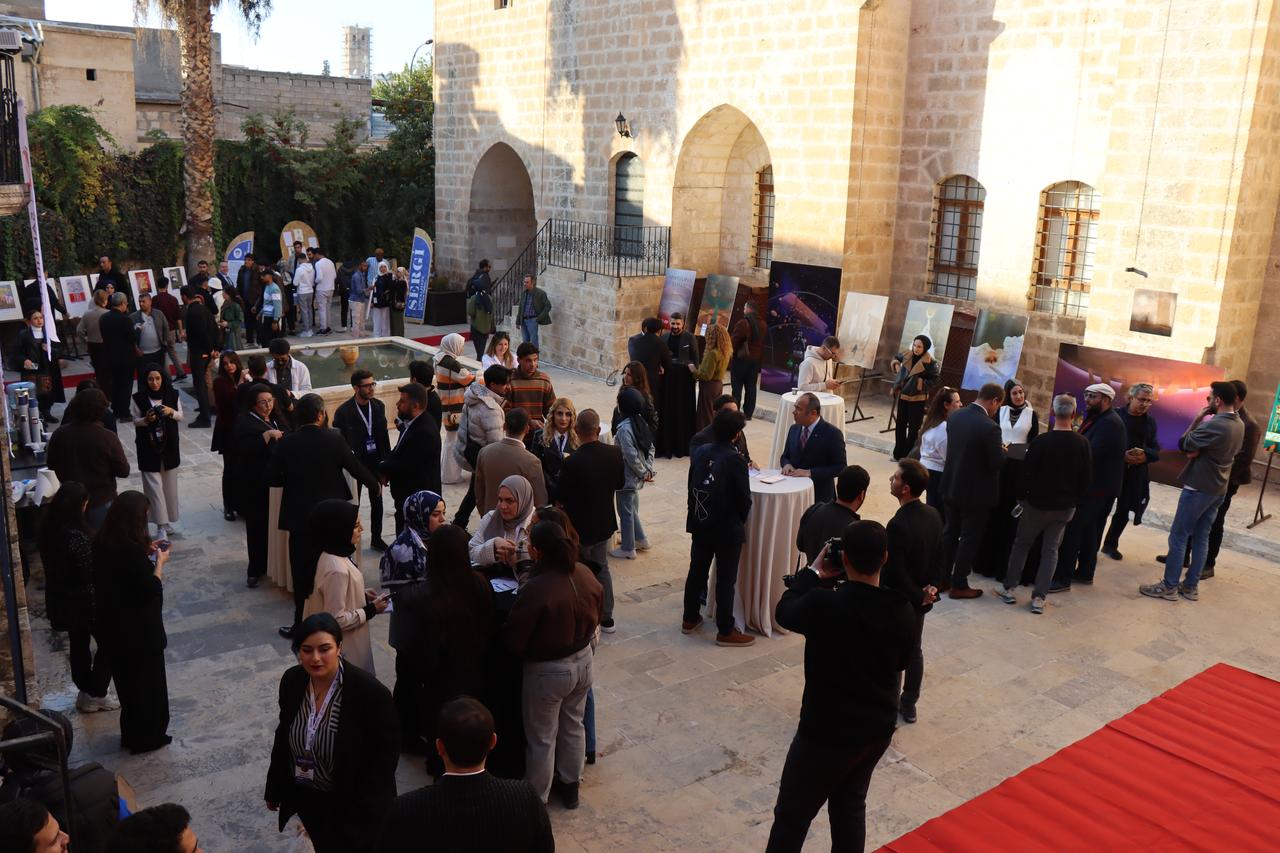 Visitors tour the exhibition area set up within the courtyard of the historic Reji Church during the 4th Gobeklitepe International Film Festival in Sanliurfa, Türkiye, Nov. 20, 2025. (AA Photo)