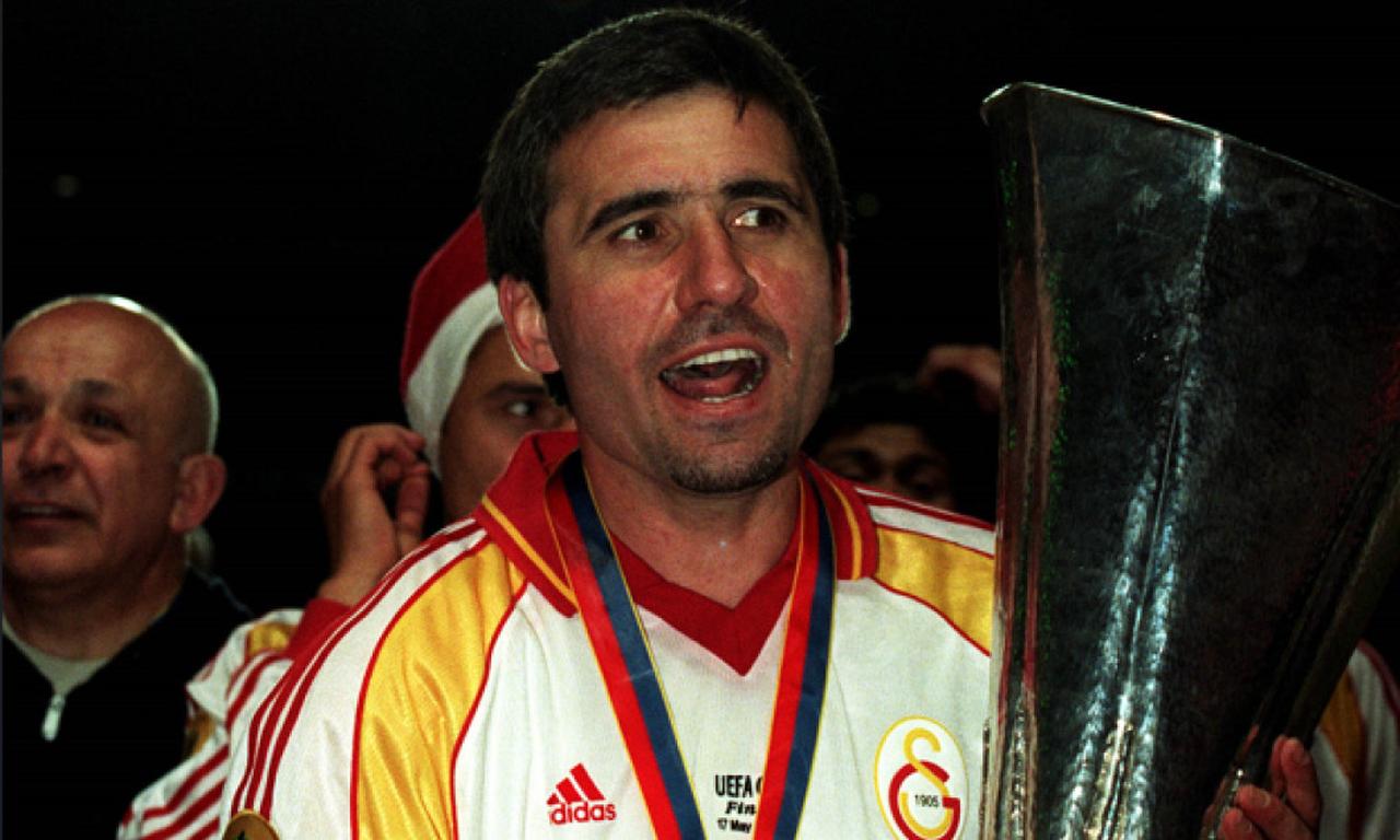 Romanian football legend Gheorghe Hagi celebrates winning the UEFA Cup with Galatasaray in 2000, holding the trophy after the historic final. (Photo via Popperfoto)