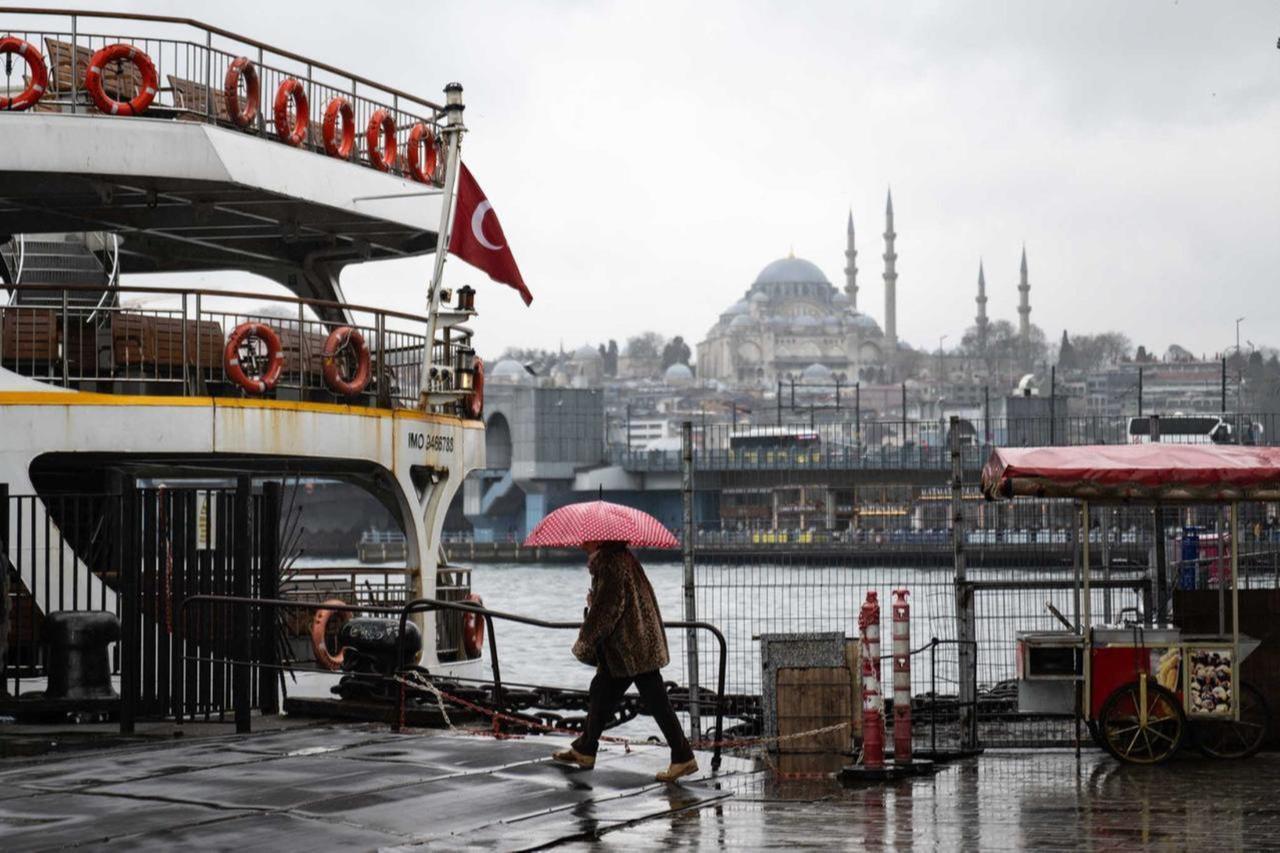 A woman walking in rainy and windy weather in Istanbul, Türkiye, March 18, 2025. (AA Photo)