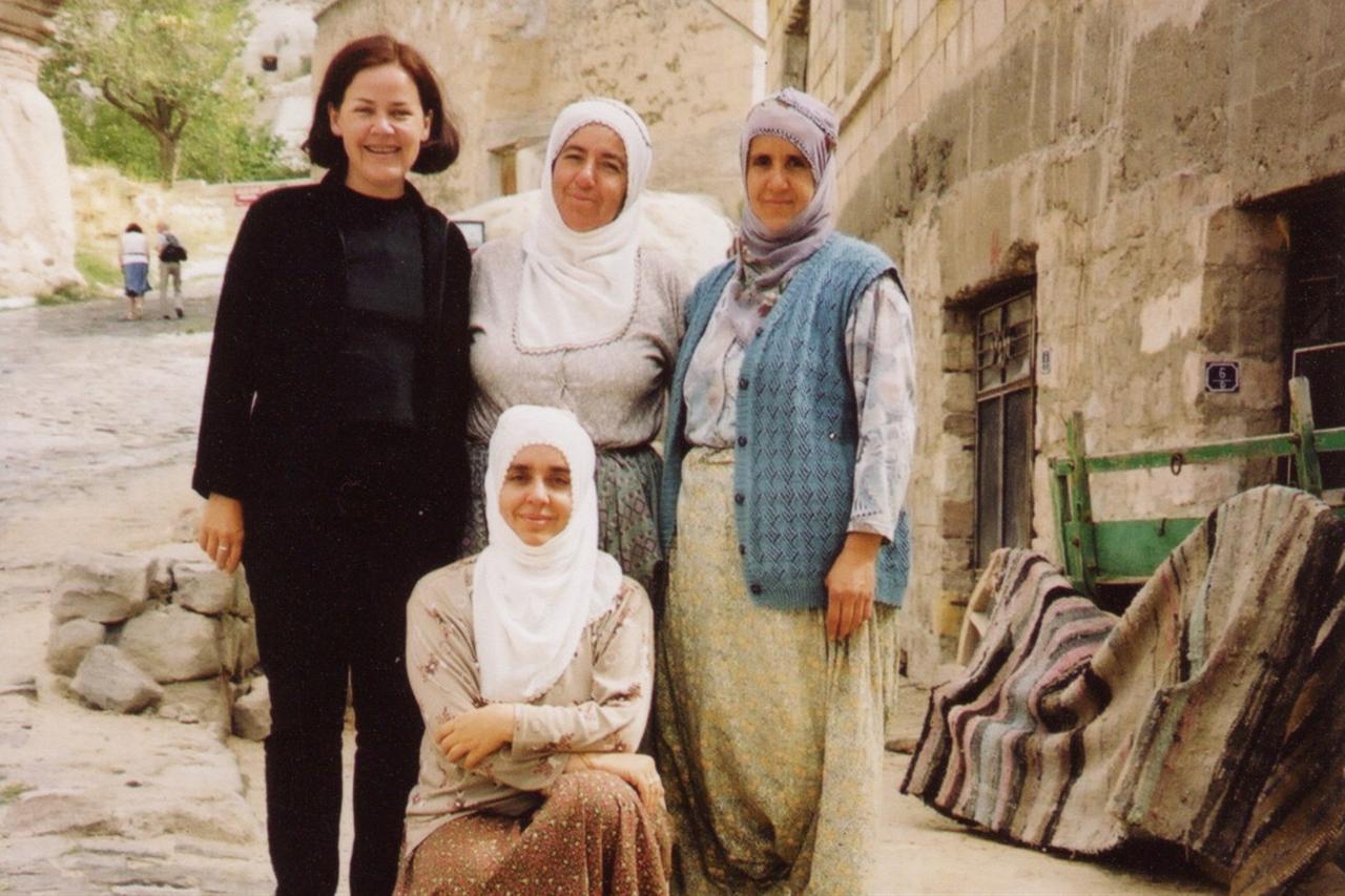 Lisa Morrow photographed with local women in a village in Goreme, where she first began observing Turkish everyday life up close, Goreme, Türkiye, accessed on November 21, 2025. (Photo via Inside Out)