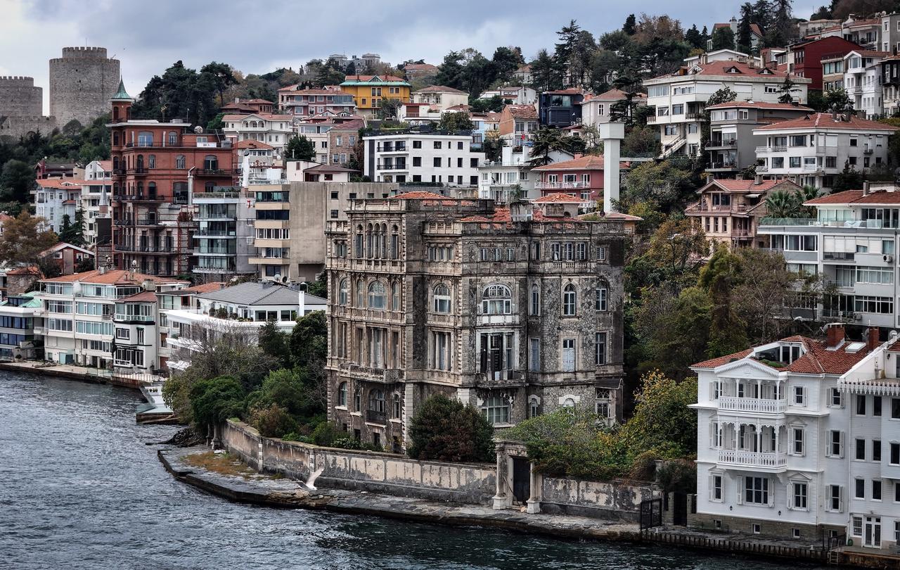 Zeki Pasha Mansion, seen along the Bosphorus shoreline beneath hillside residential neighborhoods in Istanbul, Türkiye, Nov. 22, 2025. (IHA Photo)