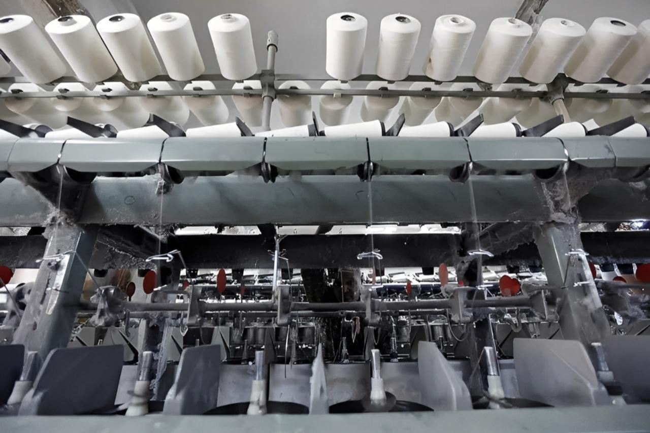Spools of cotton thread on a spinning machine at a textile factory in Cairo, Egypt. (Photo via zawya.com)