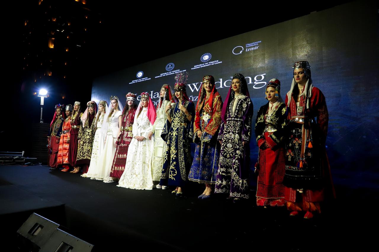 Egyptian models, wearing 15 traditional wedding dresses selected from different regions of Türkiye, take to the runway during a comprehensive cultural event reflecting a traditional Turkish wedding to mark the 100th anniversary of diplomatic relations between Türkiye and Egypt, hosted by the Turkish Embassy in Cairo, Egypt on November 20, 2025. ( AA Photo )