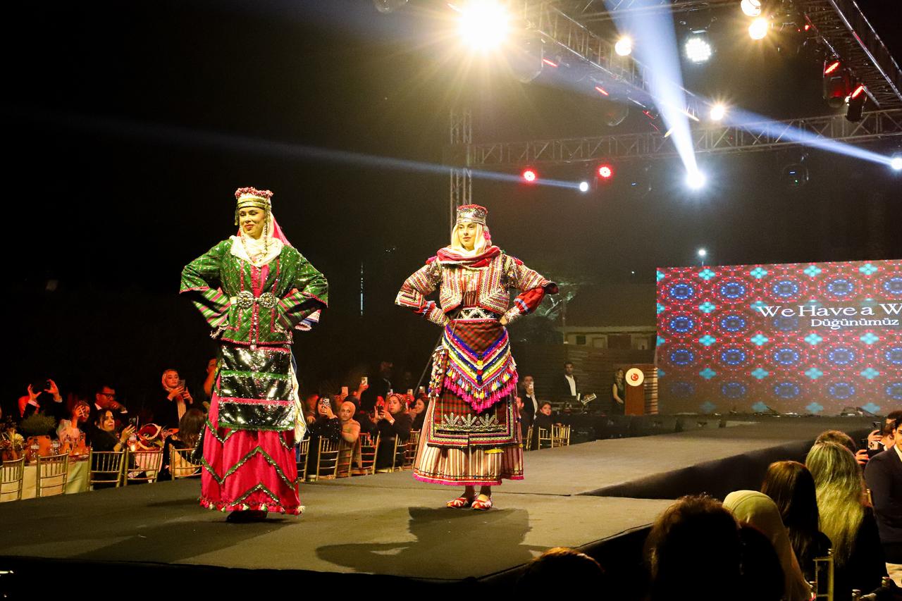 Egyptian models, wearing 15 traditional wedding dresses selected from different regions of Türkiye, take to the runway during a comprehensive cultural event reflecting a traditional Turkish wedding to mark the 100th anniversary of diplomatic relations between Türkiye and Egypt, hosted by the Turkish Embassy in Cairo, Egypt, on November 20, 2025 . ( AA Photo )
