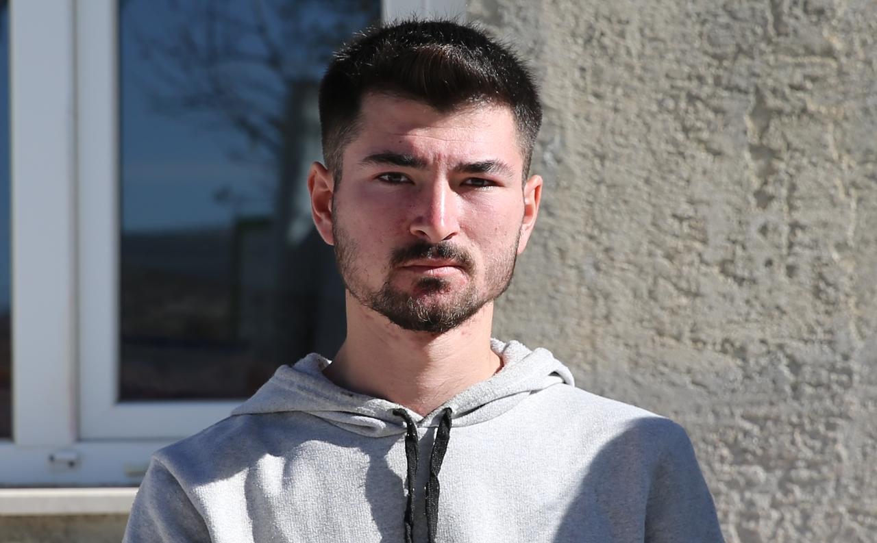 Subutay Noyan Cetin, one of the children named after historic Turkic figures, poses in front of the family home in Civril district of Denizli, Türkiye, Nov. 22, 2025. (AA Photo)
