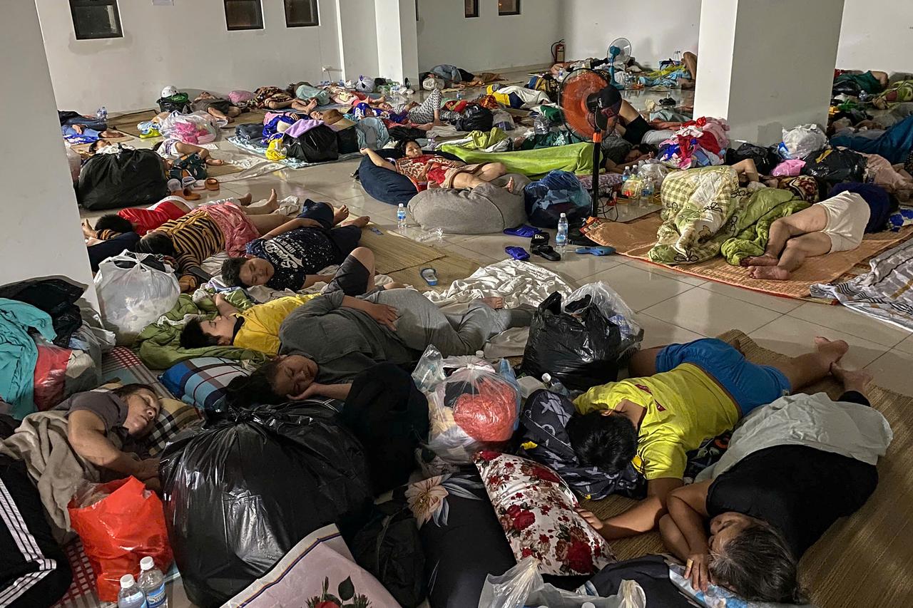 Flood-affected residents rest in a temporary shelter in Nha Trang, Khanh Hoa province, after being displaced by severe flooding. Vietnam, November 20, 2025. (AFP Photo)
