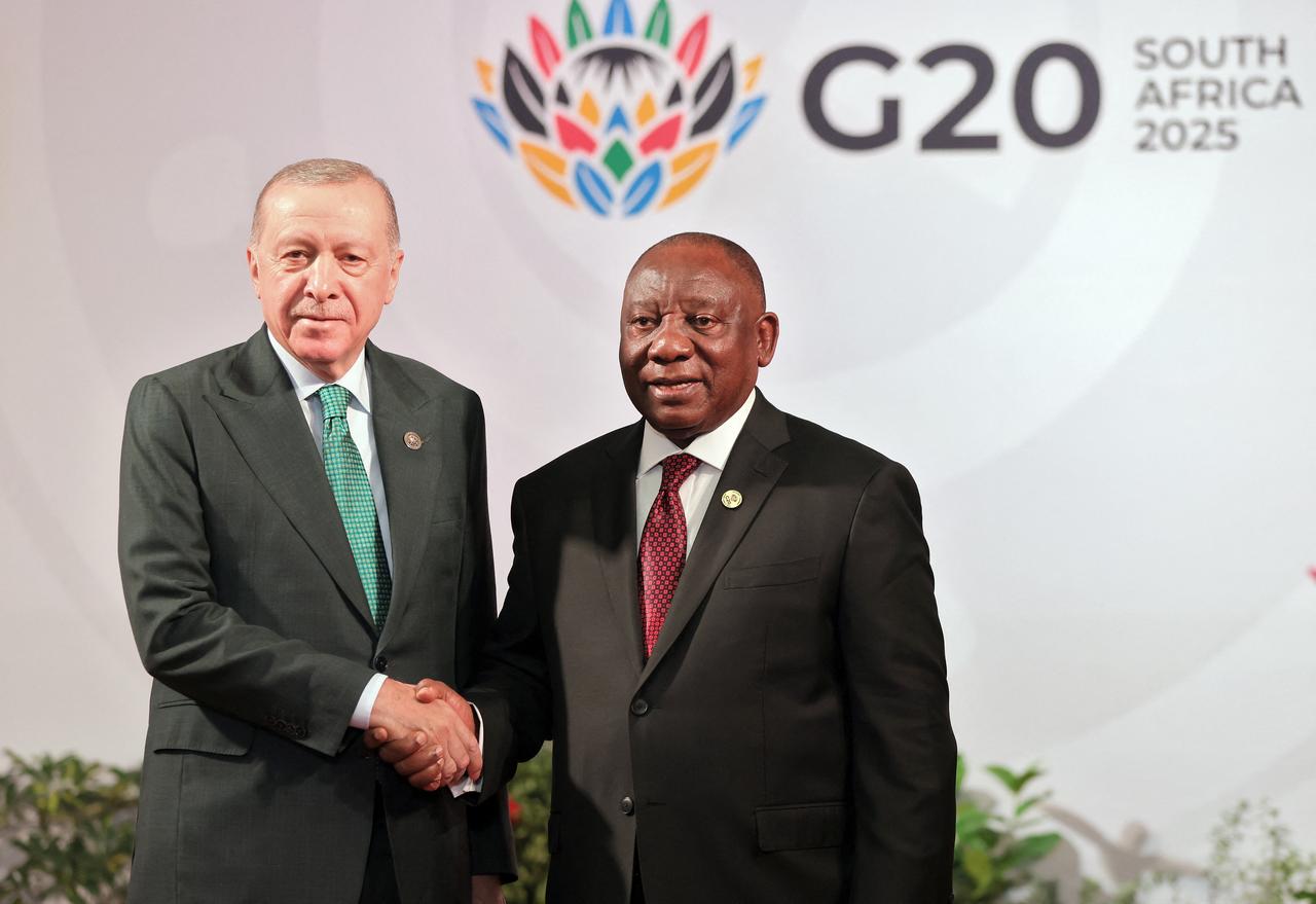 South African President Cyril Ramaphosa (R) welcomes Turkish President Recep Tayyip Erdogan as he arrives for the opening of the G20 Leaders' Summit at the Nasrec Expo Centre in Johannesburg on Nov. 22, 2025. (AFP Photo)