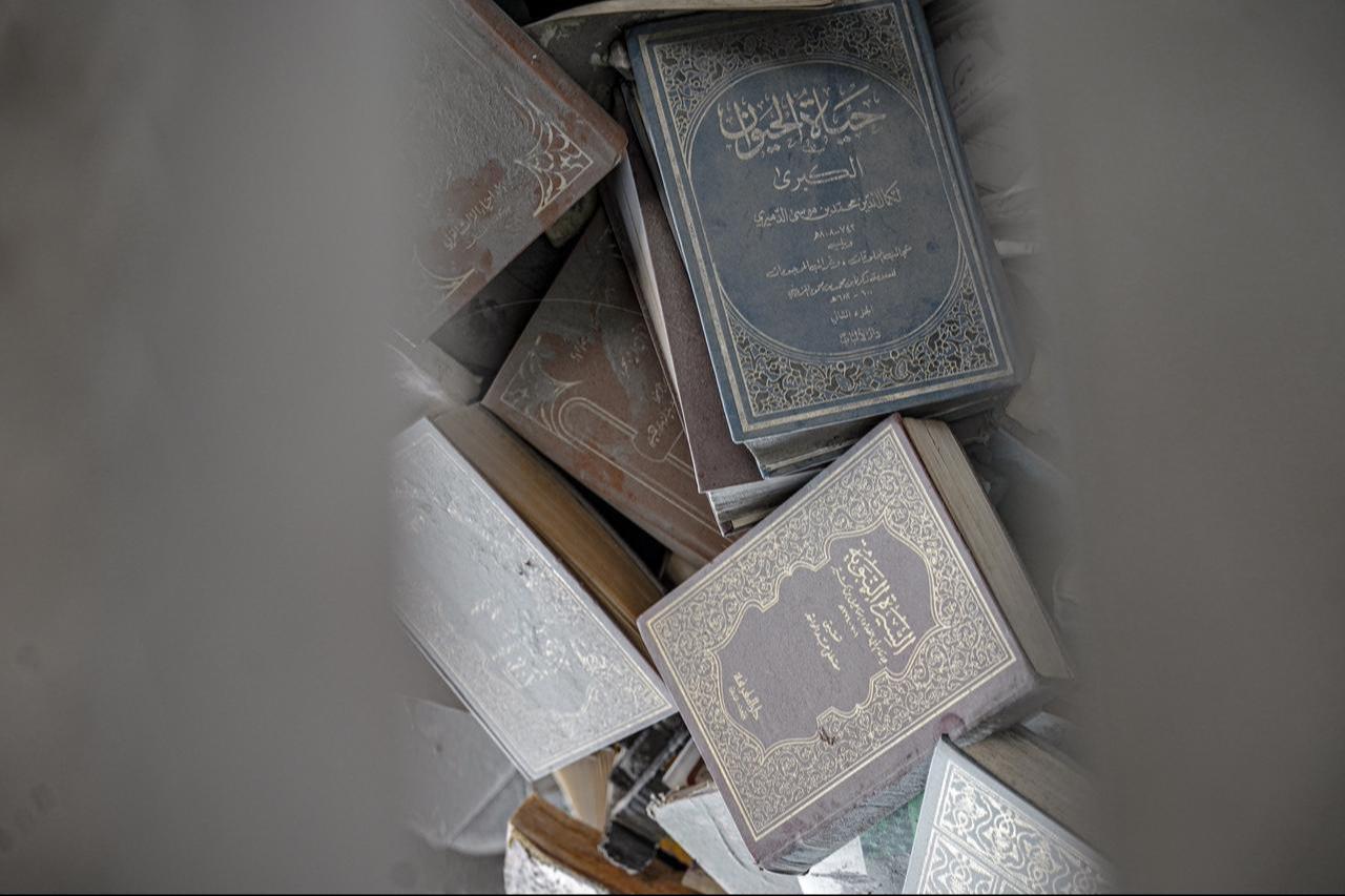 Group members work to protect the few surviving written heritage items and search for lost works after the Ghaffari Tower’s destruction, which buried the “Ayyun Ala el-Turath” group’s manuscripts and archives in Gaza City, Gaza, Nov. 20, 2025. (AA Photo)