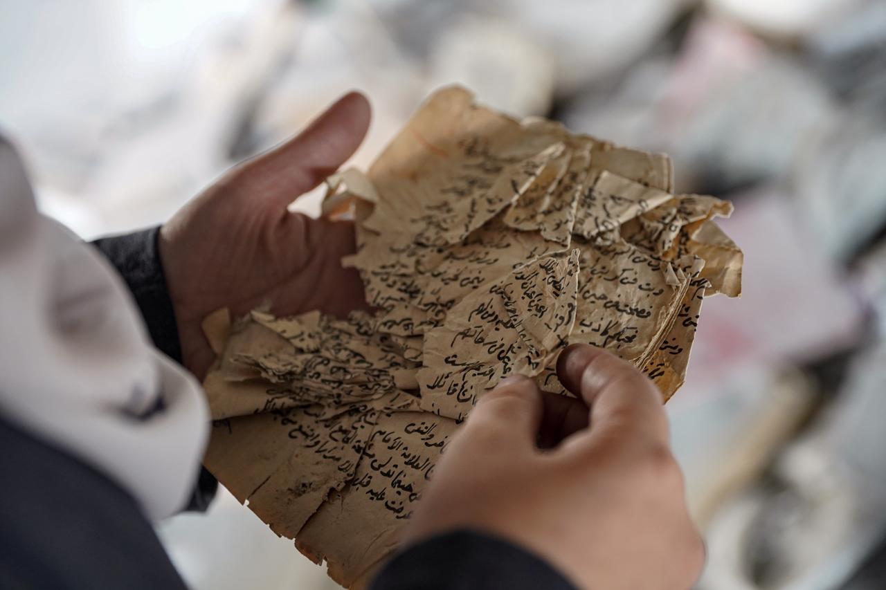 Group members continue their efforts to protect the few remaining written heritage items that survived and to locate the lost works after the debris removal efforts with the complete destruction of the Ghaffari Tower, which housed the rich archives of the “Ayyun Ala el-Turath” group, the manuscripts and valuable documents belonging to the collection were lost under the rubble in Gaza City, Gaza, Nov. 20, 2025. (AA Photo)