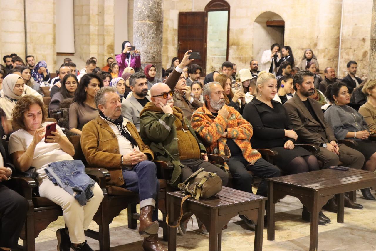 Audience members, including guest artists and jury members, attend the award ceremony of the 4th Gobeklitepe International Film Festival at the Vali Kemalettin Gazezoglu Cultural and Arts Center in Sanliurfa, Türkiye, Nov. 23, 2025. (AA Photo)