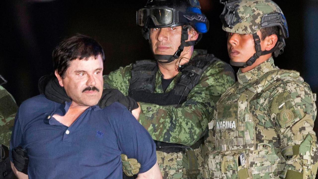 The image captures the moment of notorious drug lord Joaquín "El Chapo" Guzmán's recapture by Mexican marines on January 8, 2016. (AFP Photo)