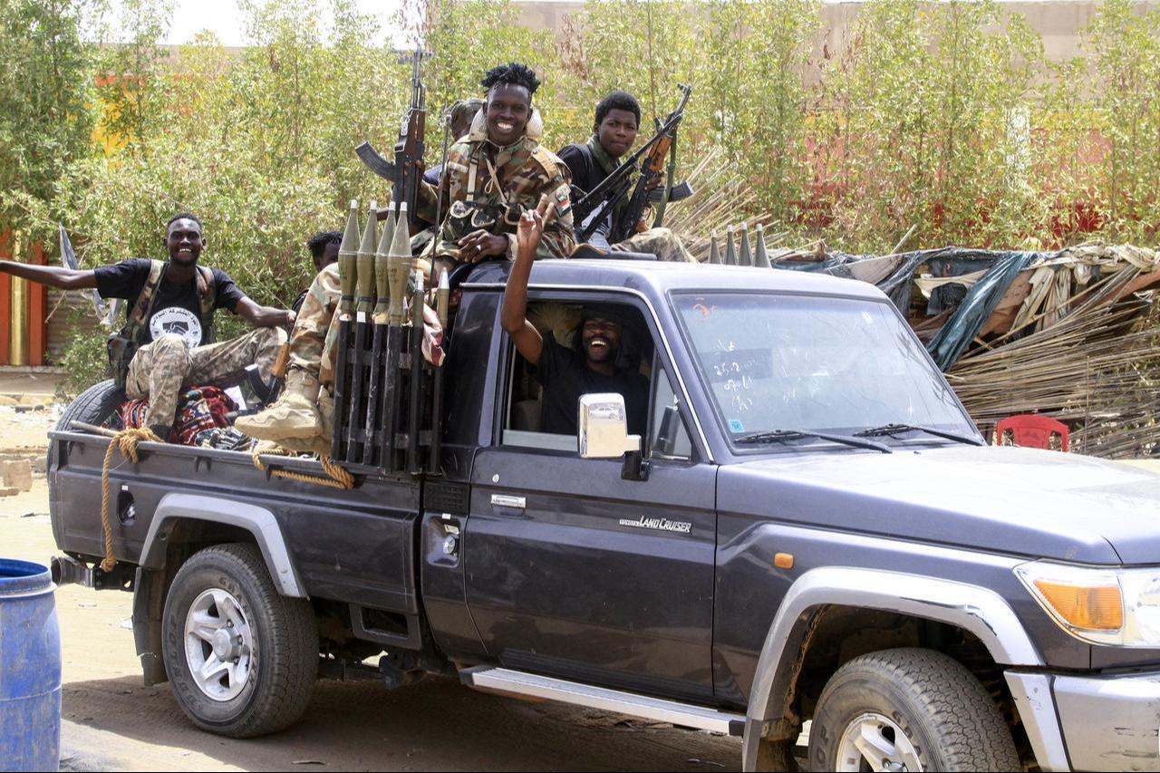 Sudanese army soldiers celebrate as they patrol in Salha, south of Omdurman, two days after the Sudanese army recaptured it from the paramilitary Rapid Support Forces (RSF), on May 22, 2025. (AFP Photo)